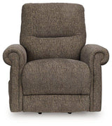 Ashley Furniture Aureta Power Lift Recliner in beige fabric with plush cushioning and padded armrests.