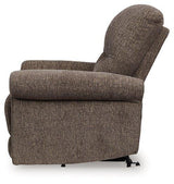 Ashley Furniture Aureta Power Lift Recliner in beige fabric with plush cushioning and a built-in remote for easy adjustment.