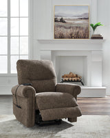 Ashley Furniture Aureta Power Lift Recliner in plush fabric with padded armrests and a supportive backrest.