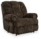 Comfortable Ashley Furniture Movie Man recliner with padded armrests and plush upholstery, perfect for relaxing.