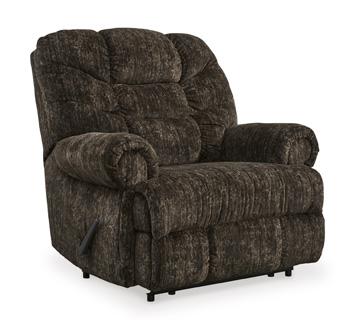 Ashley Furniture Movie Man recliner in plush fabric with padded armrests and a reclining mechanism for comfortable seating.