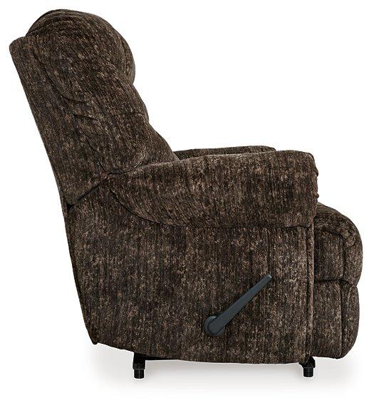 Movie Man recliner by Ashley Furniture, plush brown fabric with padded armrests and reclining feature, perfect for relaxing in the living room.