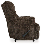 Movie Man recliner by Ashley Furniture, plush brown fabric with padded armrests and reclining feature, perfect for relaxing in the living room.