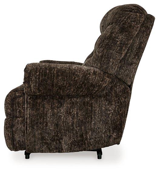 Ashley Furniture Movie Man Recliner showing plush fabric upholstery and padded armrests for comfortable seating.