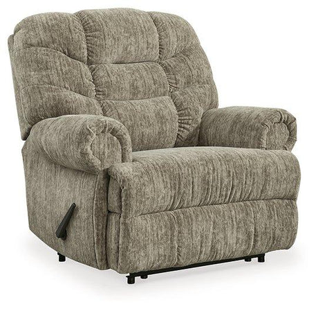 Ashley Furniture Movie Man Recliner showing plush fabric upholstery and padded armrests in a cozy living room setting.