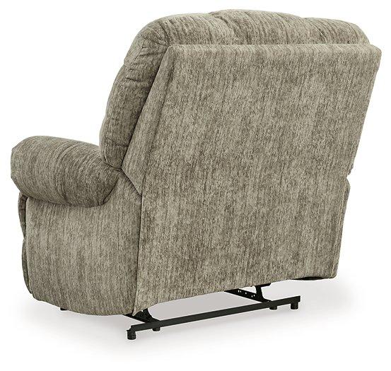 Ashley Furniture Movie Man Recliner showing plush brown fabric and padded armrests, perfect for comfortable home theater seating.