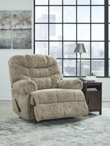 Ashley Furniture Movie Man Recliner showing plush cushioning and built-in cup holders for comfortable home theater seating.