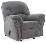 Ashley Furniture Allmaxx recliner featuring plush upholstery, padded armrests, and a reclining mechanism for comfort.