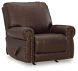 Comfortable ashley furniture Colleton recliner with plush cushioning and dark leather upholstery, shown in a cozy living room setting.
