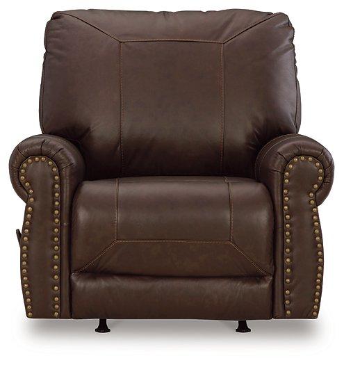 Ashley Furniture Colleton recliner with plush fabric and padded armrests, shown in a cozy living room setting.