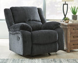 Comfortable Ashley Furniture Draycoll recliner with plush upholstery and padded armrests, ideal for relaxing in a modern living room.