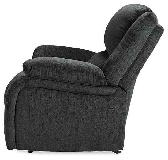 Ashley Furniture Draycoll recliner showing plush fabric upholstery and padded armrests in a modern living room setting.