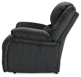 Ashley Furniture Draycoll recliner showing plush fabric upholstery and padded armrests in a modern living room setting.