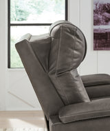 Ashley Furniture Feazada Power Recliner showing a plush brown fabric recliner with built-in power controls and padded armrests.