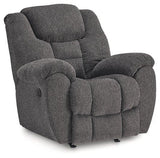 Ashley Furniture Foreside recliner showing plush fabric, cushioned armrests, and a comfortable reclining position.