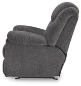Ashley Furniture Foreside recliner with plush cushioning and wooden legs, designed for comfort and stylish living room seating.