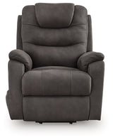 Ashley Furniture Snowfield Power Lift Recliner with plush fabric, padded armrests, and a reclining mechanism for added comfort.