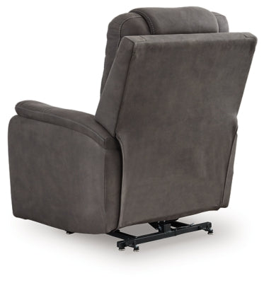 Ashley Furniture Snowfield Power Lift Recliner in neutral fabric, showing plush backrest and armrests for comfortable seating.