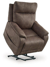 Ashley Furniture Crestmeade power lift recliner in plush fabric with padded armrests and a sturdy base for comfortable support.