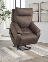 Ashley Furniture Crestmeade Power Lift Recliner with plush upholstery and padded armrests, showcasing its comfortable reclining feature.