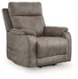 Ashley Furniture Crestmeade power lift recliner in brown fabric, showing plush cushioning and adjustable reclining features.
