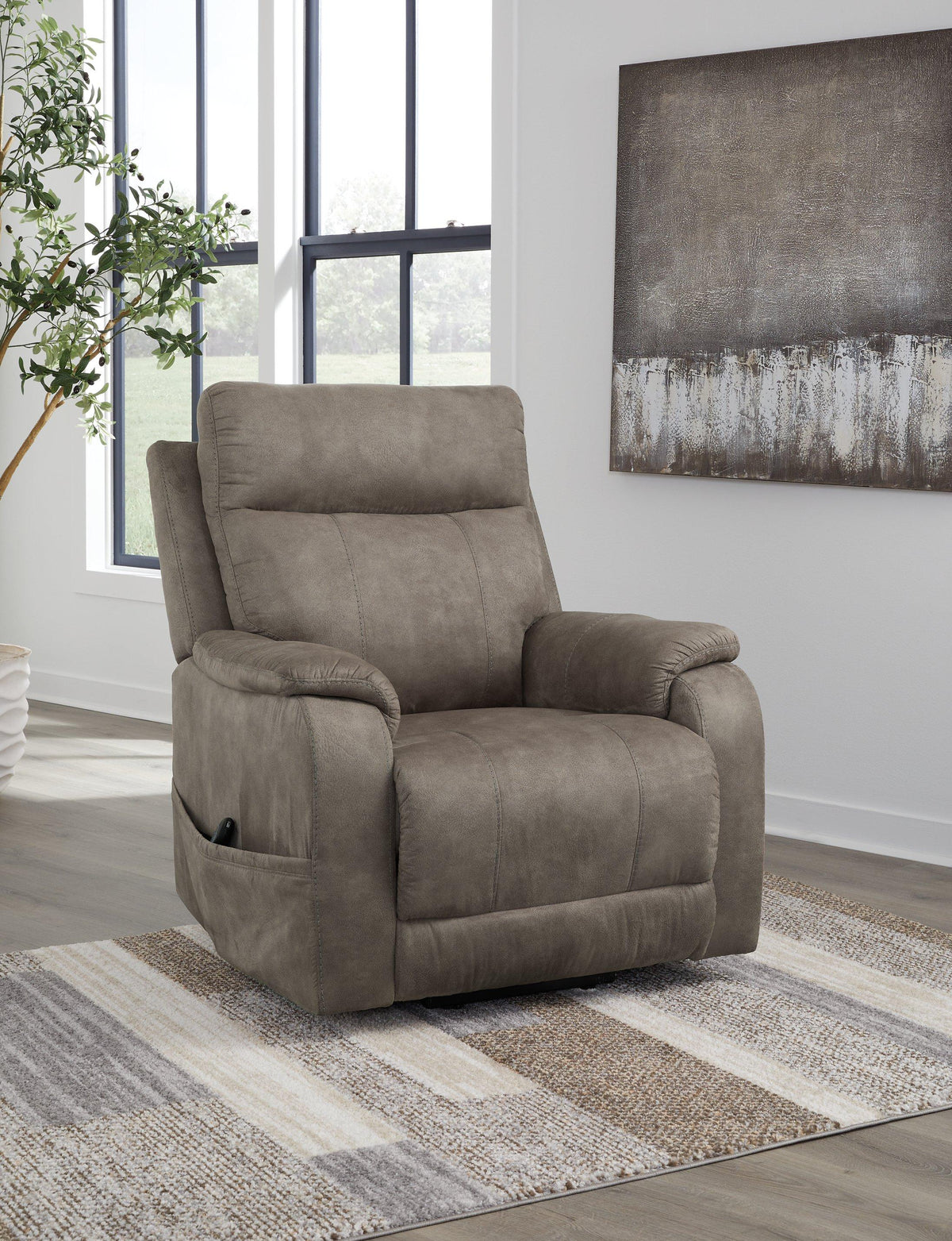 Ashley Furniture Crestmeade power lift recliner in plush fabric with padded armrests and a sturdy base, designed for comfort and support.