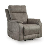 Ashley Furniture Crestmeade Power Lift Recliner in beige fabric with plush cushioning and a sturdy wooden base.