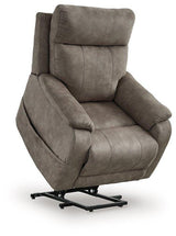 Ashley Furniture Crestmeade Power Lift Recliner showing plush upholstery and adjustable reclining features in a living room setting.