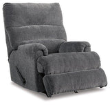 Ashley Furniture Man Fort Recliner showing a comfortable padded recliner chair with plush upholstery and armrests.