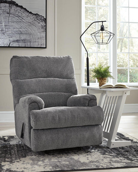 Ashley Furniture Man Fort recliner with plush cushioning and sturdy wood frame, ideal for comfortable seating.