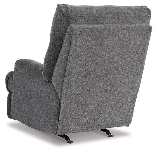 Ashley Furniture Man Fort Recliner showing a plush, beige recliner with padded armrests and a comfortable design.