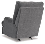Ashley Furniture Man Fort Recliner showing a plush, beige recliner with padded armrests and a comfortable design.