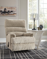 Ashley Furniture Man Fort Recliner featuring plush fabric and cushioned armrests, perfect for relaxing in style.