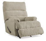 Ashley Furniture Man Fort Recliner, plush brown recliner chair with padded armrests and built-in footrest for relaxation.