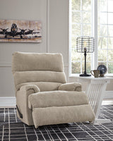 Ashley Furniture Man Fort Recliner showing a plush, brown recliner chair with padded armrests and comfortable cushioning.