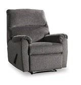 Nerviano recliner by Ashley Furniture showing plush beige fabric, padded armrests, and a comfortable reclining position.