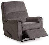 Comfortable Ashley Nerviano recliner with plush upholstery and padded armrests, perfect for relaxing in the living room.