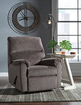 Ashley Furniture Nerviano recliner with plush fabric upholstery and padded armrests, shown in a cozy living room setting.