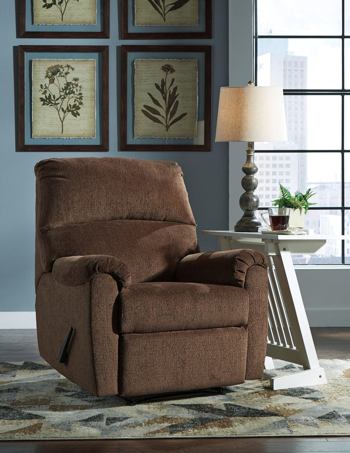 Nerviano recliner by Ashley Furniture featuring plush upholstery and a modern design, shown in a cozy living room setting.