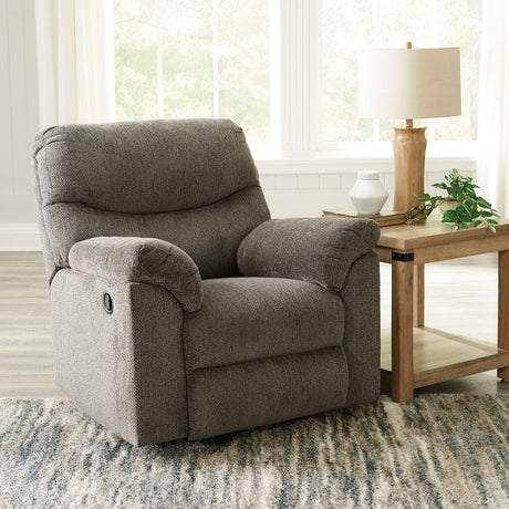 Comfortable Alphons Recliner by Ashley Furniture featuring plush upholstery and a relaxed seating design.