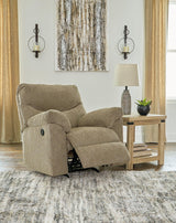 Ashley Furniture Alphons recliner in beige fabric with plush cushioning and wide armrests, perfect for comfortable lounging.