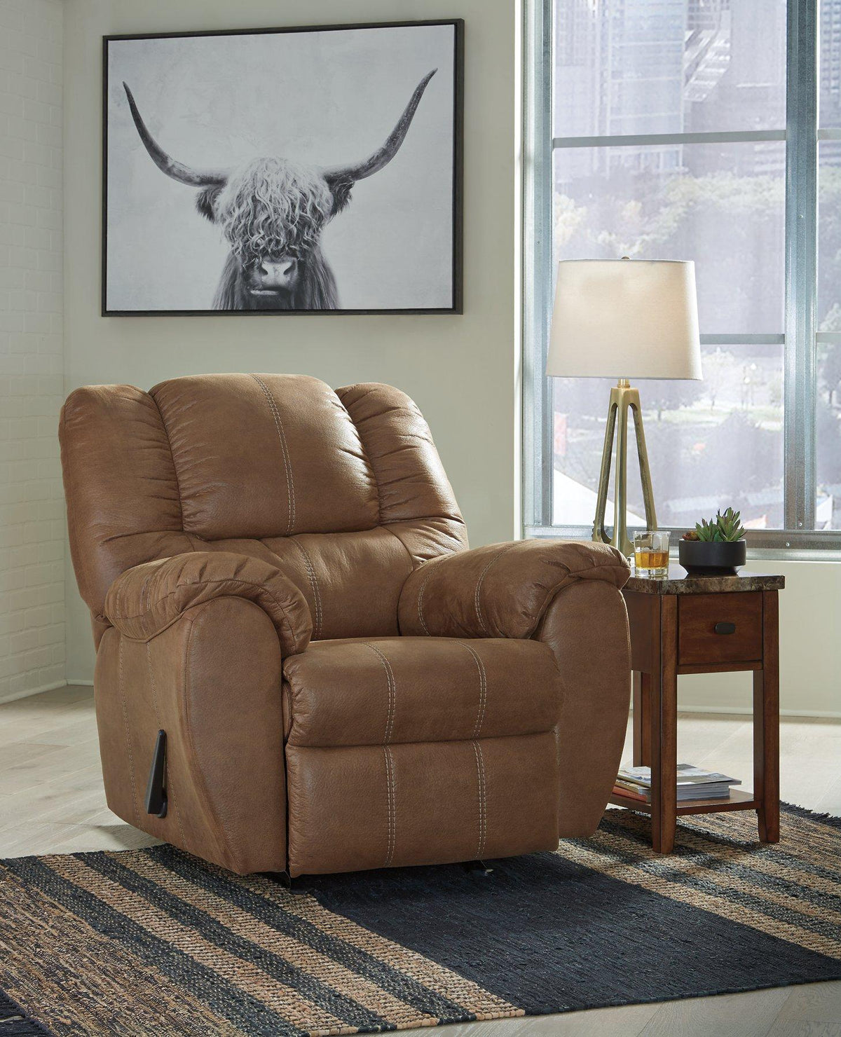 Ashley Furniture McGann recliner in beige fabric, showing plush cushioning and ergonomic design for comfortable seating.