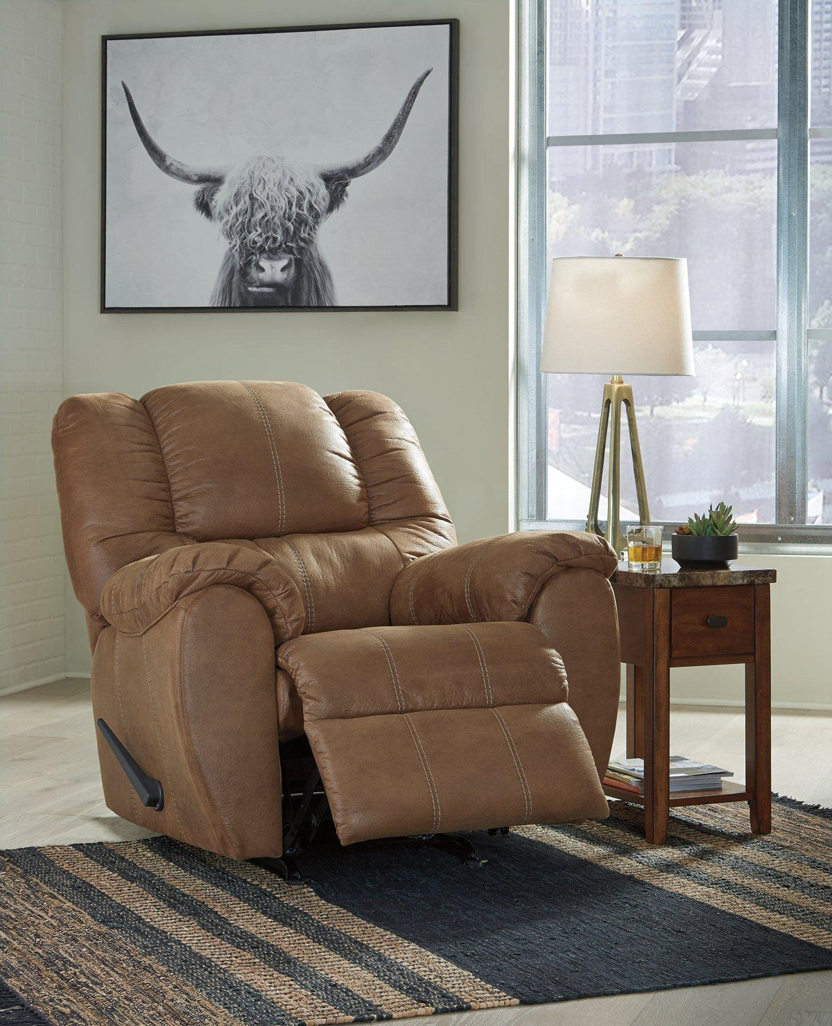 Comfortable McGann Recliner by Ashley Furniture with plush upholstery and classic design, perfect for living room relaxation.