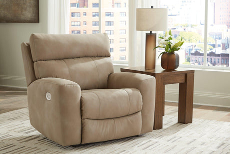 Ashley Furniture Next-Gen DuraPella Power Recliner with plush cushioning and dark leather upholstery, showcasing its reclining feature.