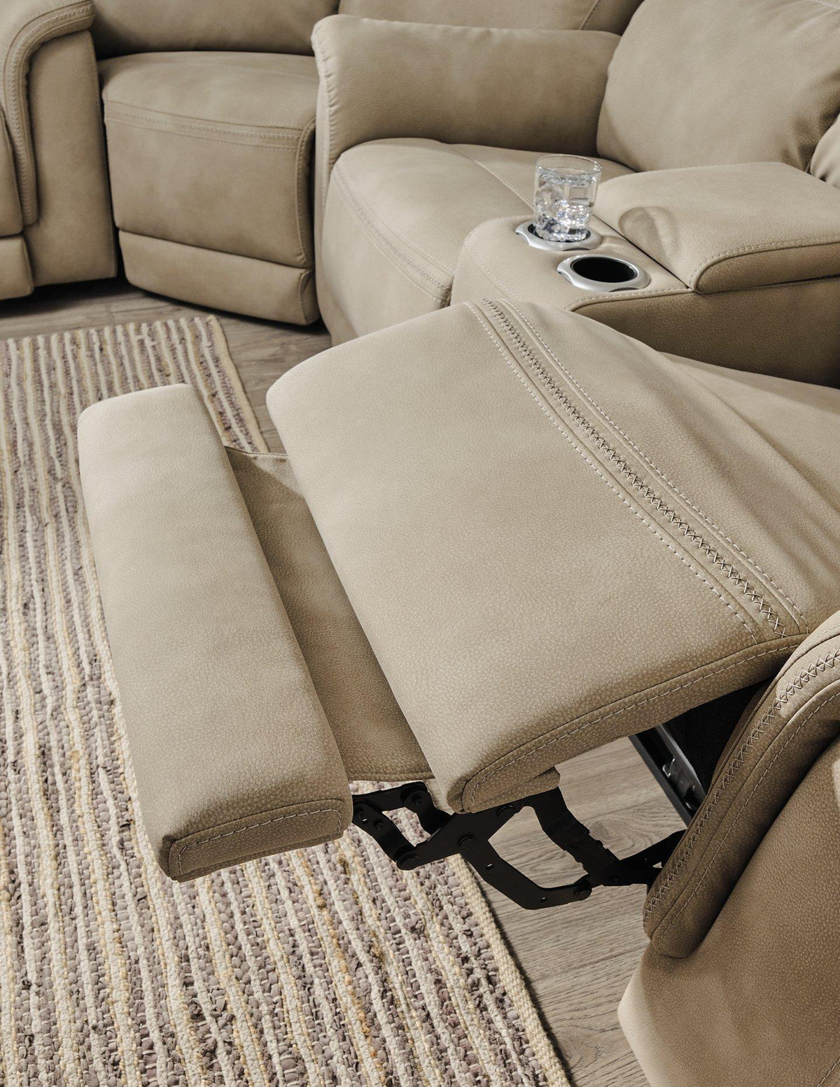 Ashley Furniture Next-Gen DuraPella Power Recliner with plush upholstery and adjustable headrest, shown in a cozy living room setting.