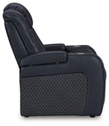 Ashley Furniture Fyne-Dyme Power Recliner shown in dark leather with cushioned armrests and a plush backrest for comfort.