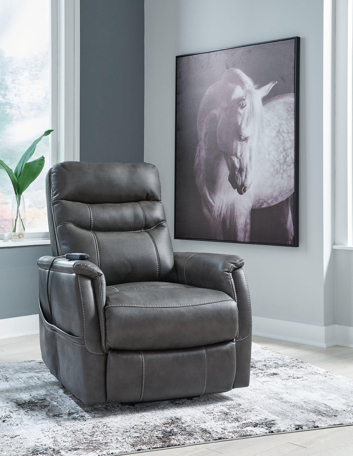 Ashley Furniture Strawbill Power Lift Recliner showing plush upholstery, ergonomic design, and built-in power lift feature.