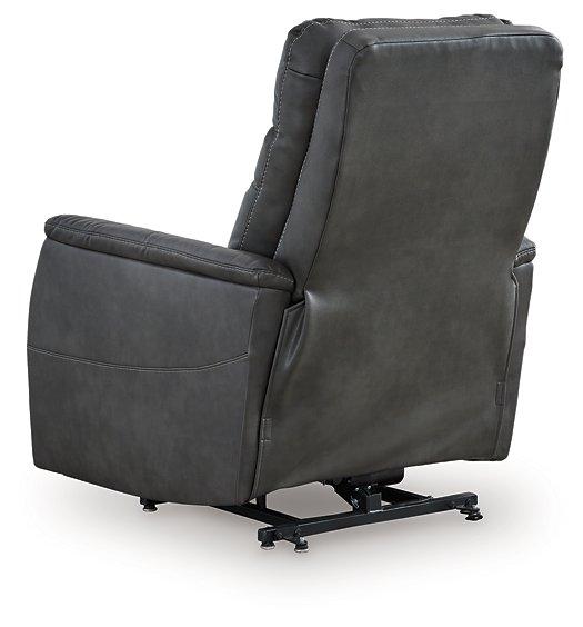 Ashley Furniture Strawbill Power Lift Recliner in tan fabric with plush cushioning and a built-in power lift mechanism.