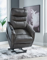 Ashley Furniture Strawbill Power Lift Recliner in tan fabric with plush cushioning and a built-in recline and lift mechanism.