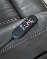 Ashley Furniture Strawbill Power Lift Recliner showing plush upholstery, padded armrests, and a reclining mechanism with control panel